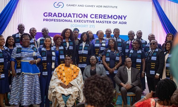 Justice Mensah-Homiah (seated middle) with Mr Gamey (left), Dr Seddoh (right) and the graduands