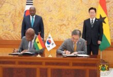Mr Ablakwa (seated left) and his counterpart signing the Agreement, whilst President Mahama and President Lee Jae Myung looks on