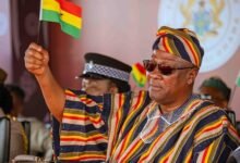 President Mahama raising high Ghana flag at the Independence Day celebration