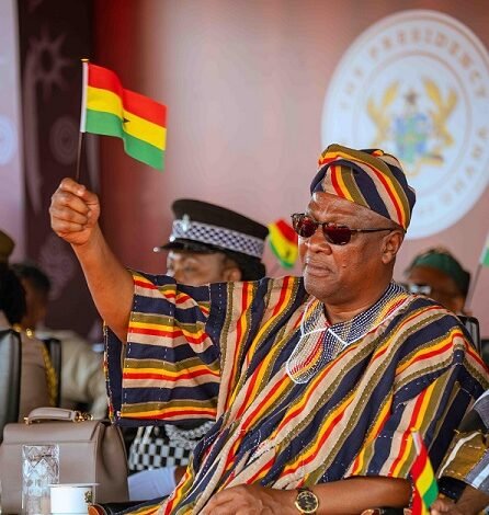 President Mahama raising high Ghana flag at the Independence Day celebration