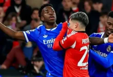 Gianluca Prestianni with mouth covered in a spat with Vinicius Jr and Eduardo Camavinga during the Champions League game