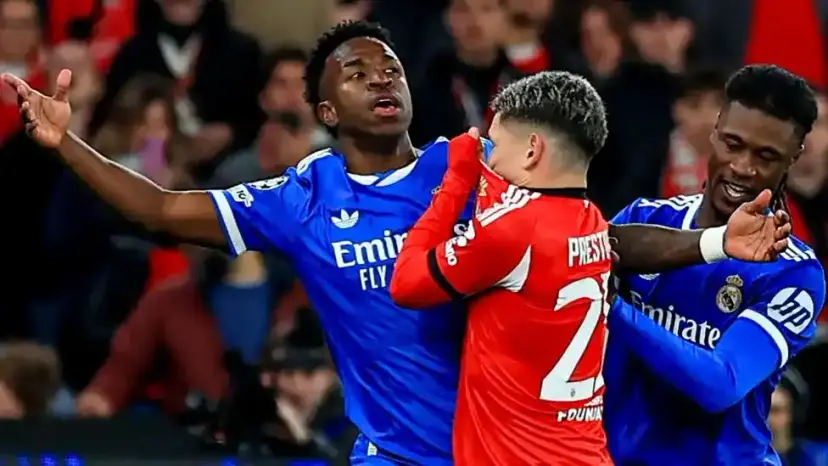 Gianluca Prestianni with mouth covered in a spat with Vinicius Jr and Eduardo Camavinga during the Champions League game