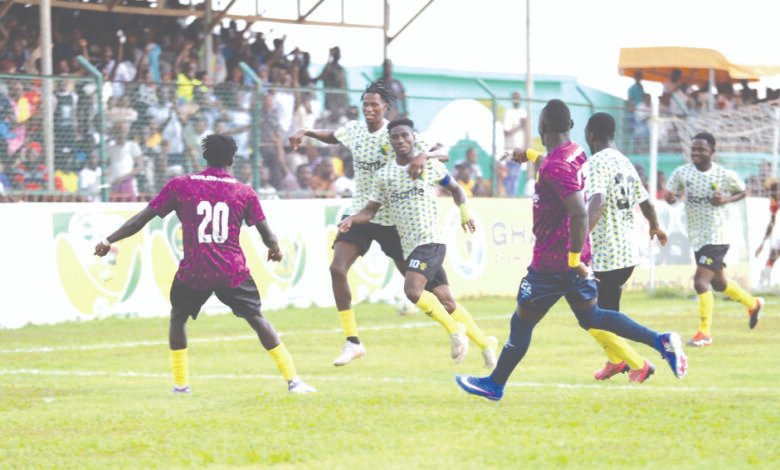 Gold Stars players join Atta Kumi to celebrate the opening goal