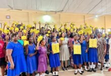Ms Ocloo (middle) with some beneficiary students and teachers of Tetteh Ocloo School for the Deaf during the distribution exercise