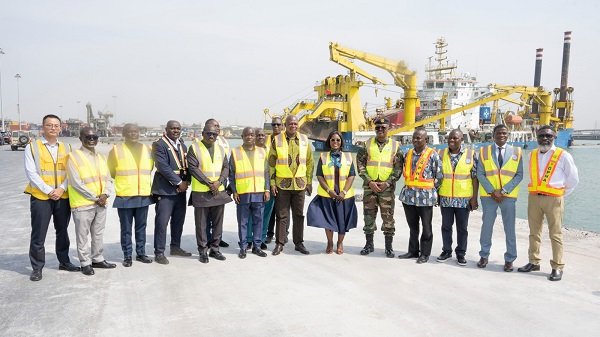Mr Nikpe (middle) with some ministers and dignitaries during his visit to the Tema Harbour