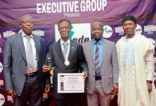 Mr Ayawine (second from left) with other ICU officials after receiving the award