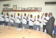 Mr Atakey (right) inaugurating the members of the Union Photo Victor A. Buxton