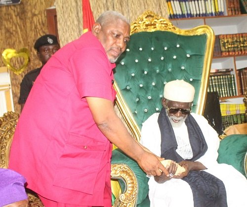 Mr Joshua Quist (left) Regional Director, NRSA handing over the money in an envelop to National Chief Imam, Sheikh Osman Nuhu Sharabutu. Photo. Ebo Gorman