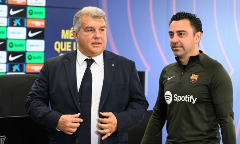 Joan Laporta (left) with Xavi