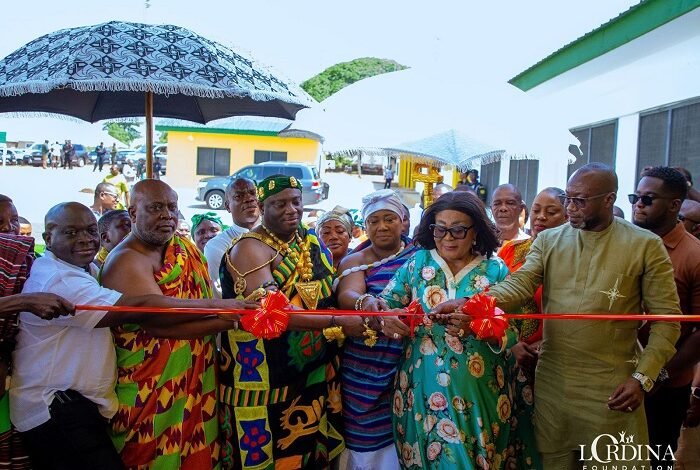 Mrs Mahama (second from right) being assisted by other dignitaries to cut the tape to inaugurate the facility