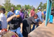 Officials drinking water at the inauguration
