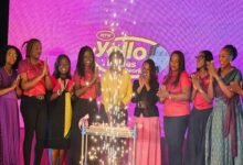 Participants in the programme cutting the anniversary cake at the programme