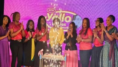 Participants in the programme cutting the anniversary cake at the programme