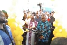 MTN handsMr James Gunu (right) cutting the tape to inaugurate the facility