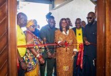 Madam Efua Houadjeto supported by Nana Boateng Gyimah commissioning the office