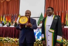 President Mahama (left) showing recognition at the AU court anniversary