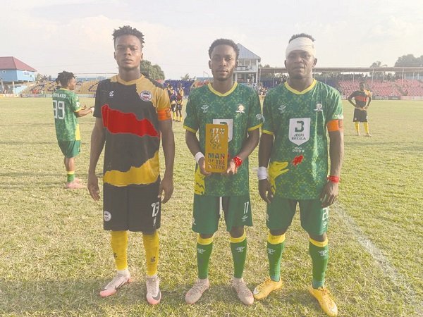 Man of the Match Amponsah (middle) Flankled to the left by the Most Promising Player Koulibaly of Liberty Youth and best defender Boakye