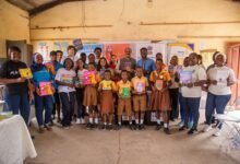 Mr Agorvor-Otchie (arrowed) together with executives of Mayekoo Foundation, its partners and volunteers after the presentation
