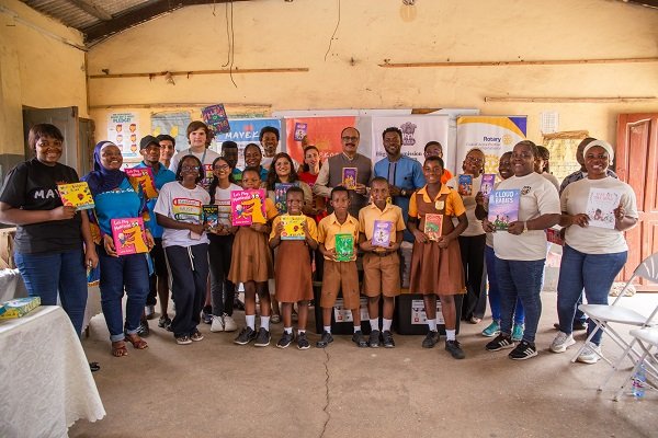 Mr Agorvor-Otchie (arrowed) together with executives of Mayekoo Foundation, its partners and volunteers after the presentation
