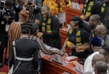 President Mahama (left) exchanging pleasantries with Mr Afenyo-Markin