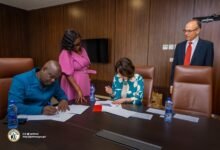 Mr Adjei (left) and Dr. Zankina signing the MoU Agreement