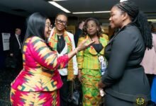 Mrs Mahama (left) interacting with other guests at the programme