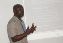 Mr Herbert Malm (inset) addressing stakeholders at the meeting. Photo. Ebo Gorman