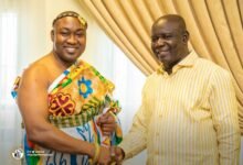 Mr Adjei (right) welcoming Ohempon Dr Asiamah to his office