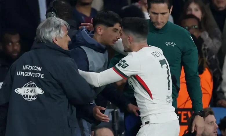 Pedro Neto embraces a PSG ball boy in the aftermath of shoving him during their Champions