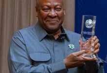 President Mahama displaying his award