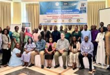 Mr Azortibah (seated right) with Mr Beers (seated, third from right) and other dignitaries at the programme