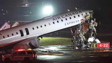 • The Air Canada Express CRJ-900 sits on the runway after colliding with a Port Authority re truck at LaGuardia Airport in New York yesterday