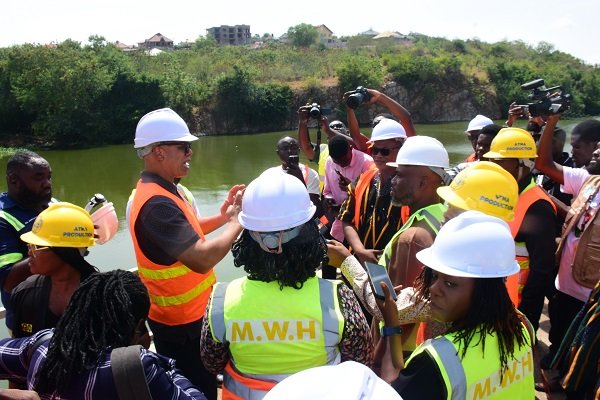 Mr Adam Mutawakilu (second from left) briefing Mr Gilbert Adjei (second from right) on activities at the Weija Water Works Photo Seth Osabukle