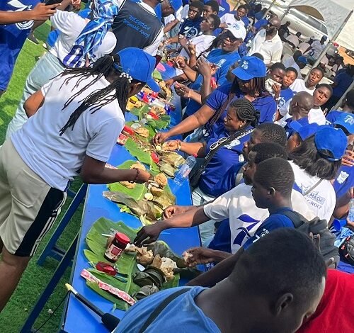 Former and current students of Wesley Grammar eating together during the celebration