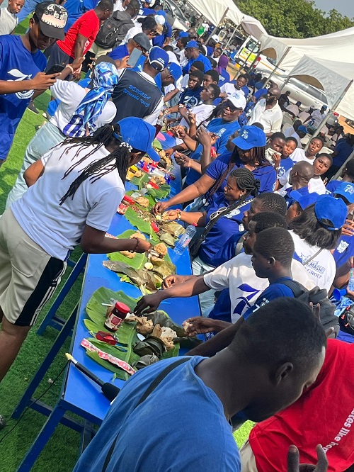 Former and current students of Wesley Grammar eating together during the celebration