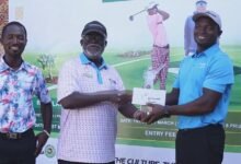 • Manasseh (right) receiving his prize