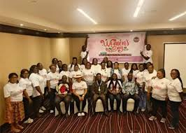 • Mr Ayawine (seated middle) with the women