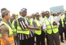 Ms Yvonne Nana Afriyie Opare (third from right) showing Mr Joseph Nikpe Bukari (in smock) the new phototype outlook of the Terminal 2 Departure Hall. Photo. Ebo Gorman.JPG
