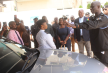 • DSP Alexander Obeng (hand stretched) brieng Mr Nikpe (third from right) and his deputy on the vehicles installed with camera's meant to monitor road traf c offenders