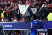 Real Madrid's Vinicius Junior looks on from the side of the pitch as the match was stopped due to racist chants