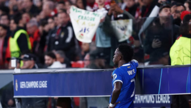 Real Madrid's Vinicius Junior looks on from the side of the pitch as the match was stopped due to racist chants