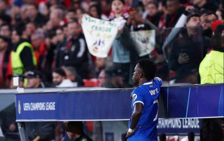 Real Madrid's Vinicius Junior looks on from the side of the pitch as the match was stopped due to racist chants