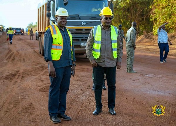 President Mahama (right) and Mr Agbodza inspecting the Jinijini–Sampa road at Berekum during the tour