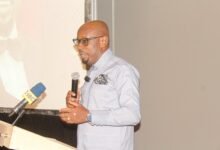 Prof Hinson (inset) launching the conference. Photo. Ebo Gorman