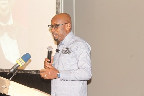 Prof Hinson (inset) launching the conference. Photo. Ebo Gorman