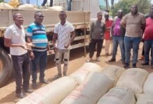 The suspects with some of the cocoa bags