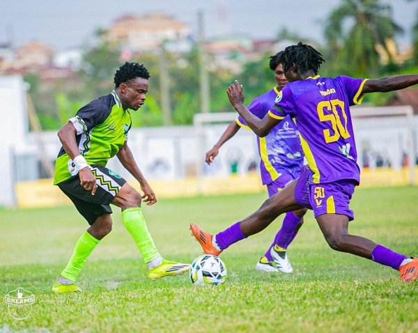 A Dreams FC defender (left)attempts to stop a Medeama SC attacker