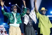 Mr Obeng (left) and others waving at the crowd during the programme