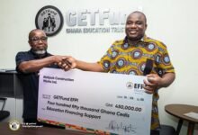 Mr Tweneboah-Kodua (left) presenting the dummy cheque to Mr Dandaawa