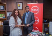 Mr Botchway (right) exchanging the agreement document with Madam Seddoh